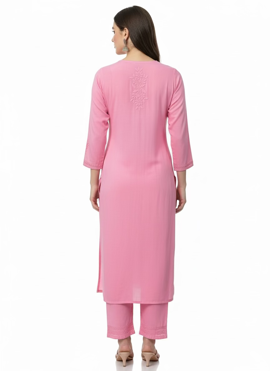 The back side design of this Baby pink colour modal fabric tone to tone hand embroidered kurti and trousers. Kurti is 46 inches long