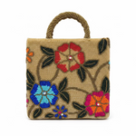 The beige-coloured floral handcrafted tote bag with glass bead embroidery and an internal strap.