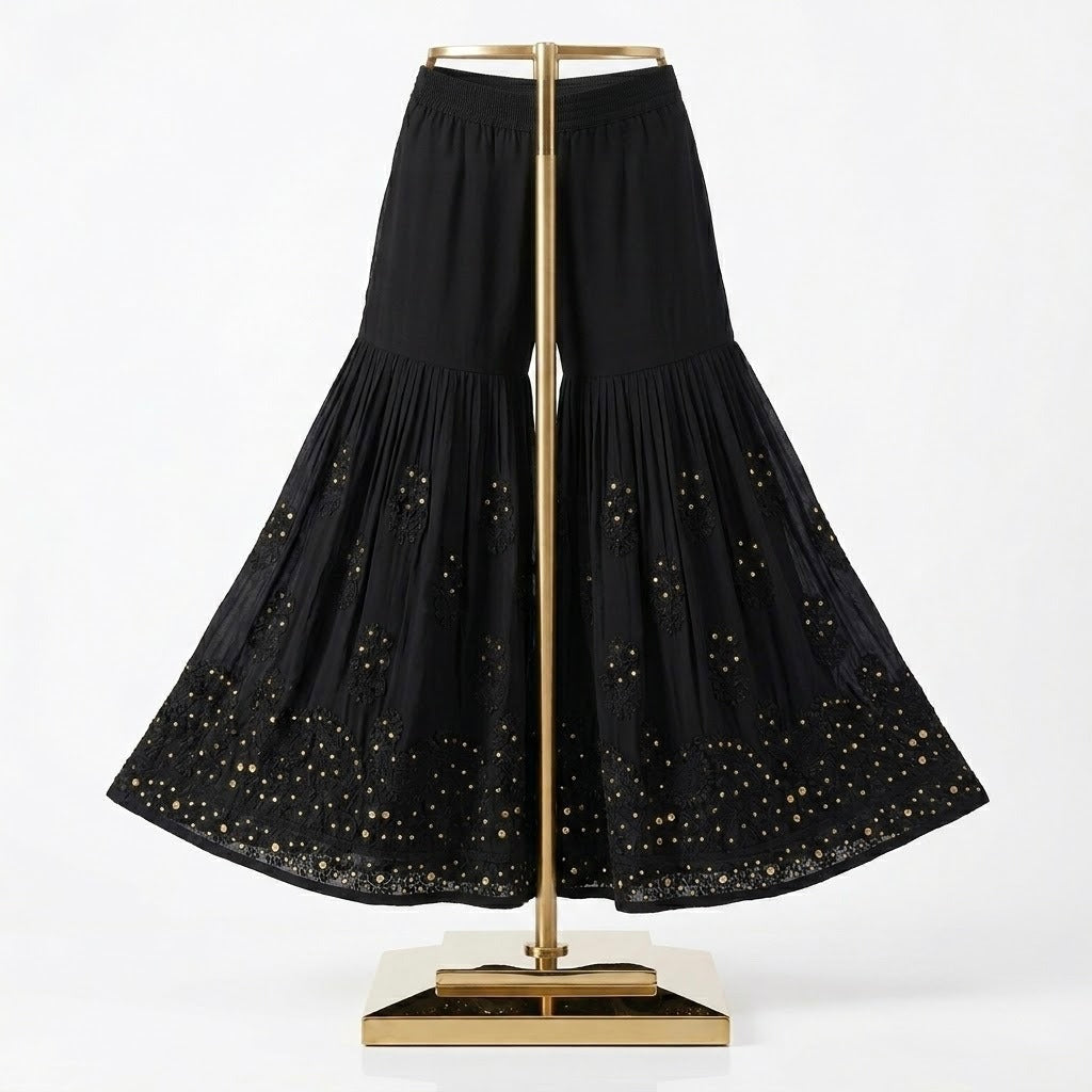 The black cotton Gharara with antique kaamdani work