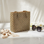 The tote bag with gold diagonal lines and long beads handcrafted on a gold silk base