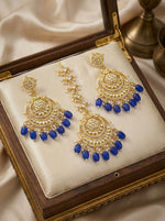 Traditional Indian Maang Tikka and jhumka earring with a sapphire-toned bead fringe and intricate kundan center.