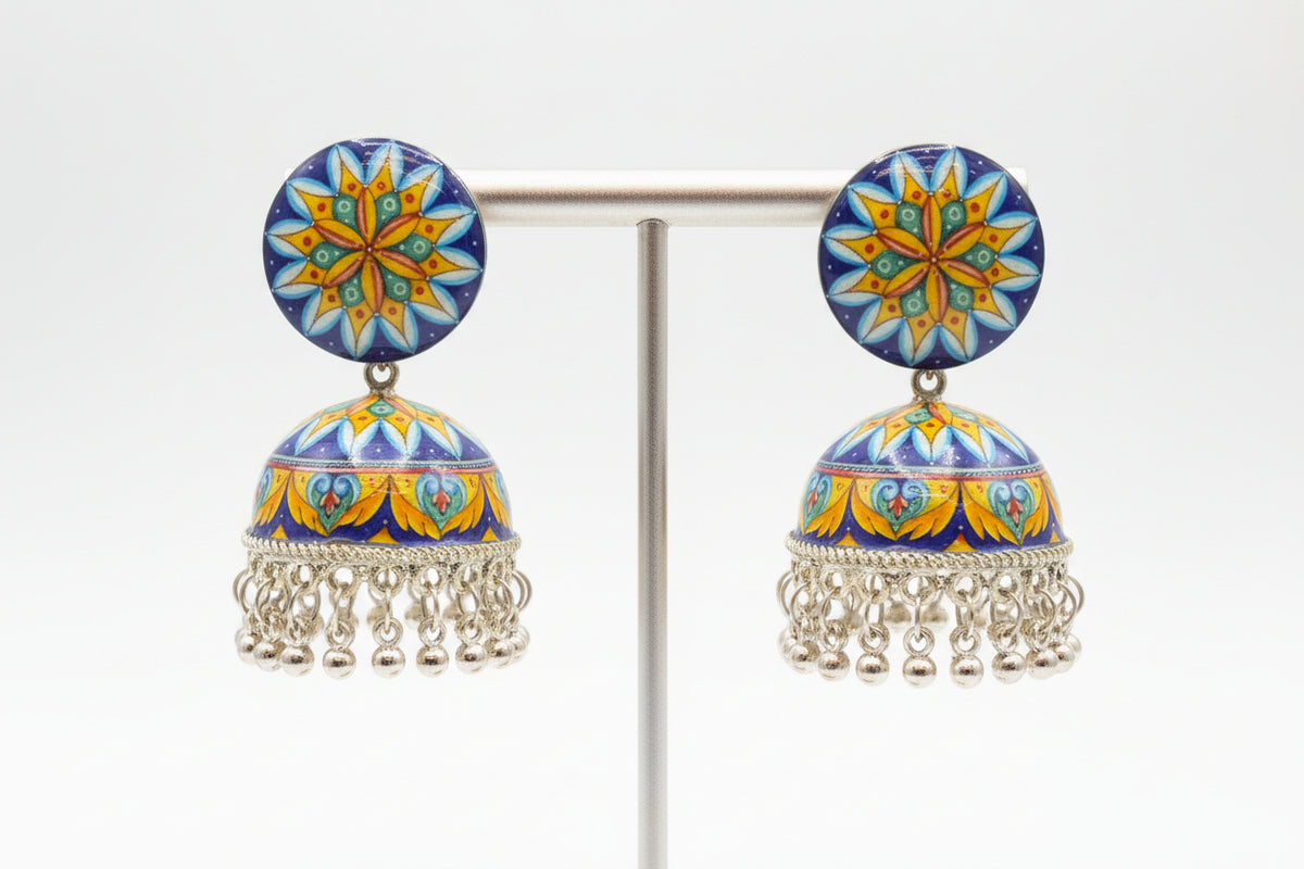 Traditional lightweight plastic jhumka earrings featuring vibrant floral patterns and silver-toned accents.