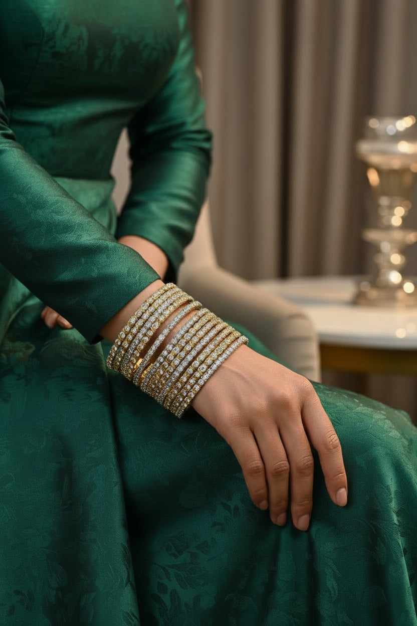A stack of 12 twisted rope-style dual-tone bangles with high-quality American Diamonds, displayed on a gold jewelry stand.