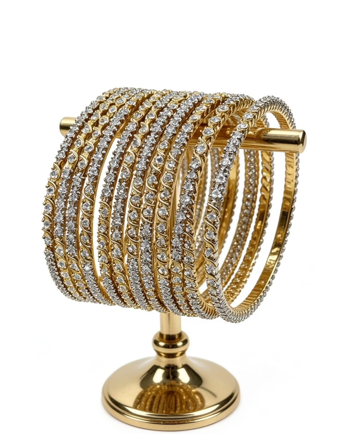 A stack of 12 twisted rope-style dual-tone bangles with high-quality American Diamonds, displayed on a gold jewelry stand.