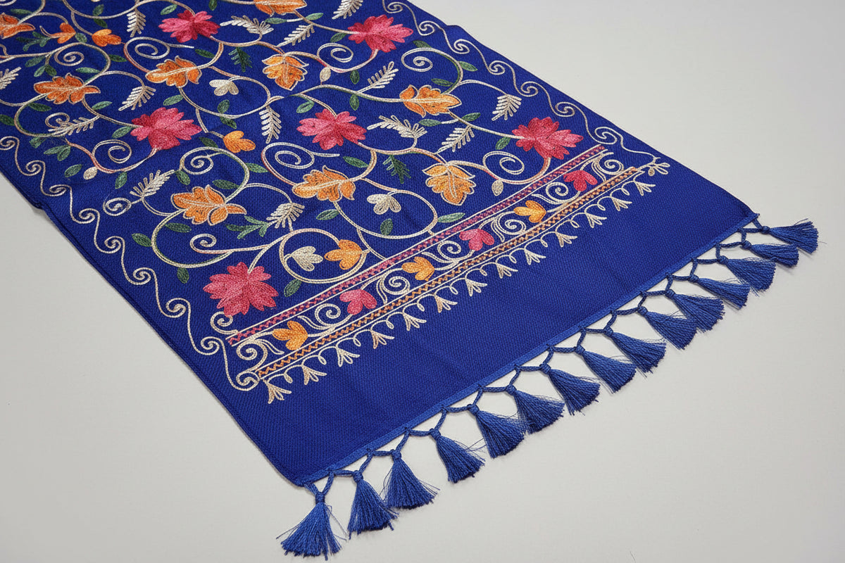  blue colour pashmina scarf with Kashmiri embroidery in a floral pattern, featuring tassels on the ends.