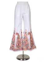 A professional studio product listing shot of white semi-georgette sharara pants displayed on a silver mannequin stand against a solid white background, showcasing the soft flowy drape, elastic waistband, and a sheer organza bottom border with multi-hued embroidery.