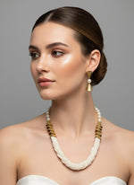 White braided mala with gold accents and matching earrings by famaza couture 