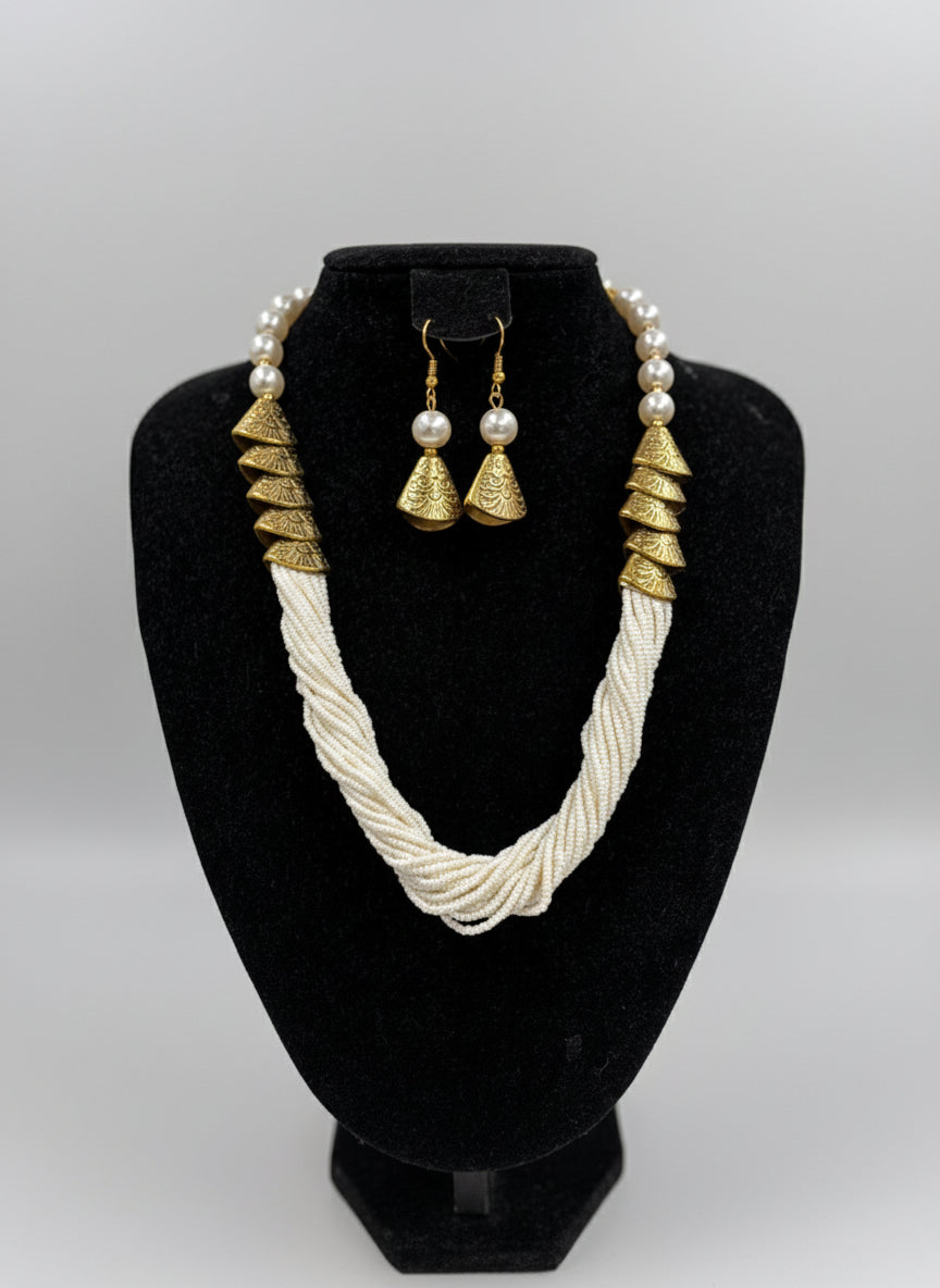White braided necklace with gold accents and matching earrings by famaza couture 