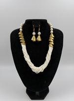 White braided necklace with gold accents and matching earrings by famaza couture 