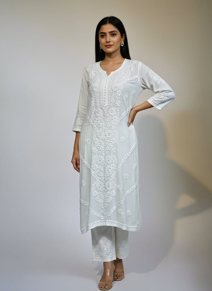 White colour modal fabric long kurti and trousers with floral hand embroidery on kurti and trousers. 