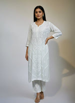 White colour modal fabric long kurti and trousers with floral hand embroidery on kurti and trousers. 
