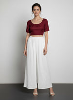 White hand embroidered trousers by famaza couture 