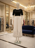 White reyon fabric hand embroidered trousers by famaza couture 