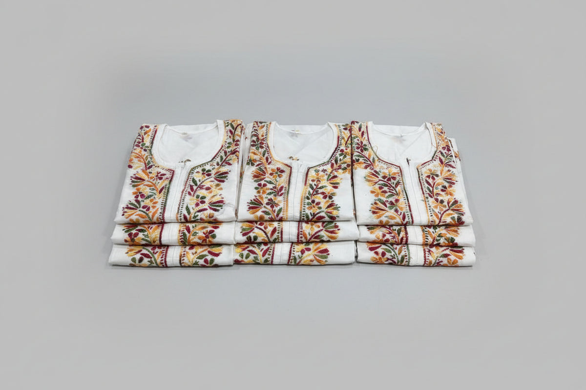 White shirts with colourful floral embroidery 