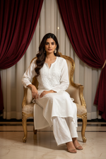 Side angle view of the elegant premium white 2-piece Lucknowi Chikankari co-ord dress showing its fluid drape and regular fit