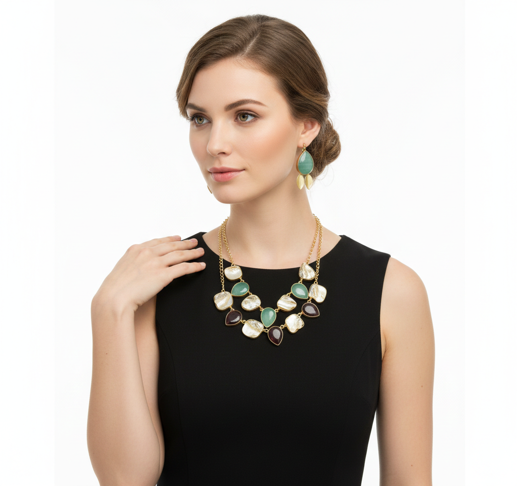 Woman wearing a gold and green necklace on a white background