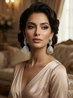 Woman wearing elegant earrings in a luxurious setting