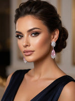 Woman wearing elegant earrings with a blurred background