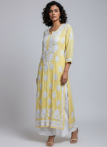 Yellow colour Chikankari kurti top with large floral embroidery by famaza couture 