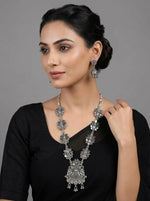 Young woman wearing an Antique Finish Floral Lattice Necklace and Jhumka set, styled as posh evening jewellery for a bridal or party wear look, British English fashion photography.