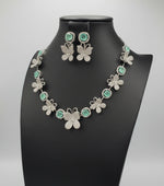 a jewellery set of white Nano American diamonds and turquoise central stone earrings by famaza couture 