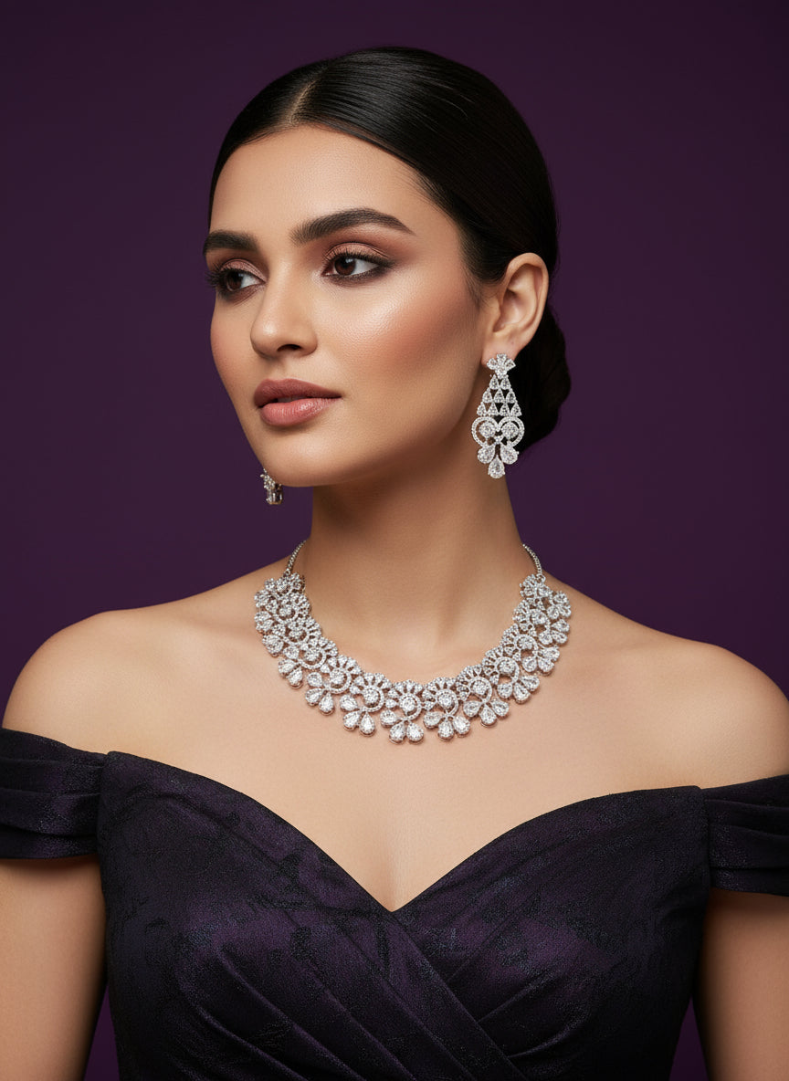 a silver floral design necklace set with matching earrings, adorned with clear, high-shine cubic zirconia by famaza couture 