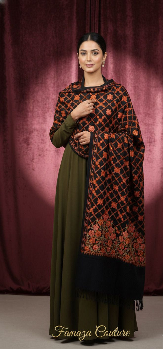 Woman wearing a patterned outfit with a dark background, featuring the brand 'Famaza Couture'.
