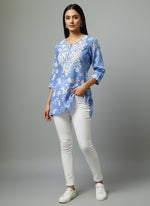 blue colour machine embroidered printed short length kurti with white jeans by famaza couture 