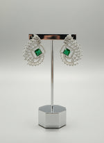 bottle green centre stone earrings, featuring a geometric design with intricate detailing, displayed on a mannequin. Party wear set.