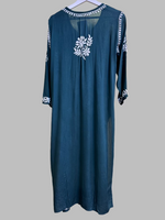 rear view of embroidered bottle green kurti with floral motifs and detailed border work
