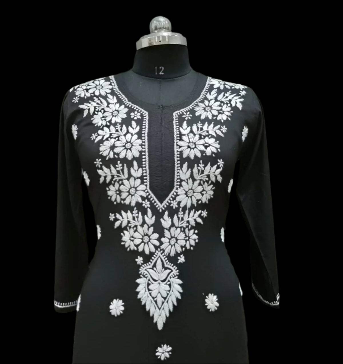 close up of black modal kurti with white hand embroidery in a Ghass Patti pattern and booti work.