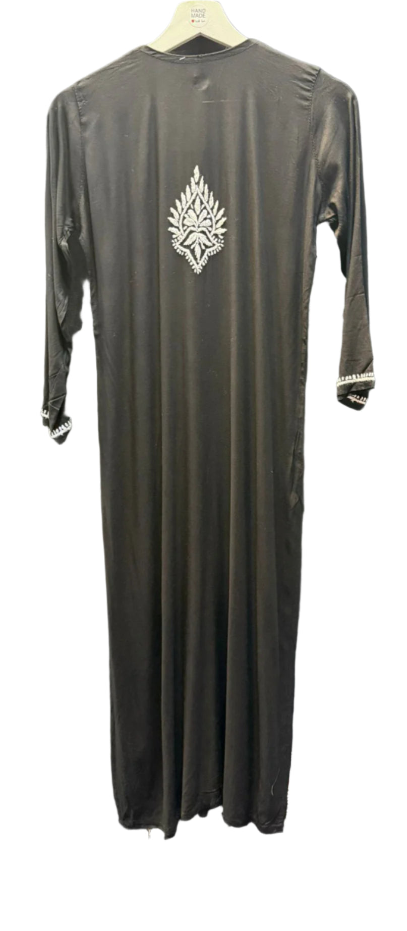 rear view of black modal kurti with white hand embroidery in a Ghass Patti pattern and booti work.