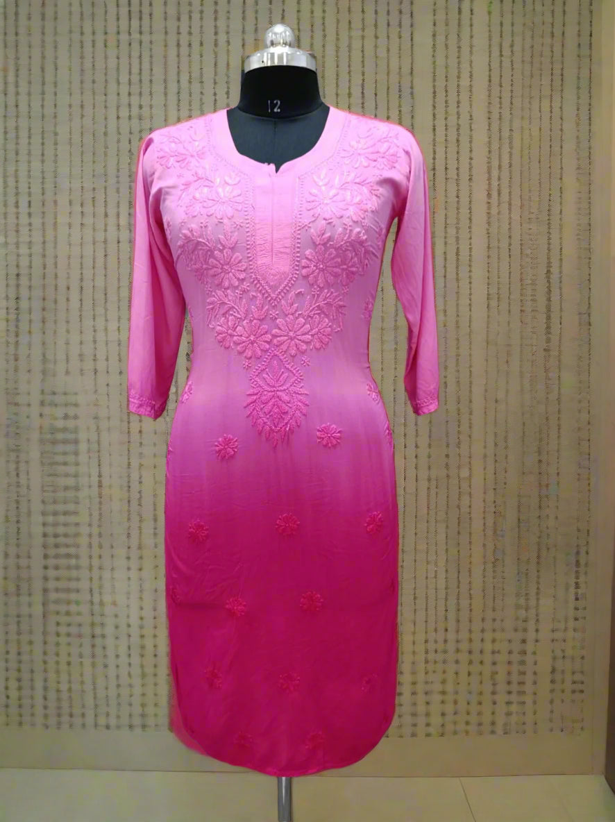 A long kurti in shades of magenta with tone to tone floral embroidery displayed on a mannequin.