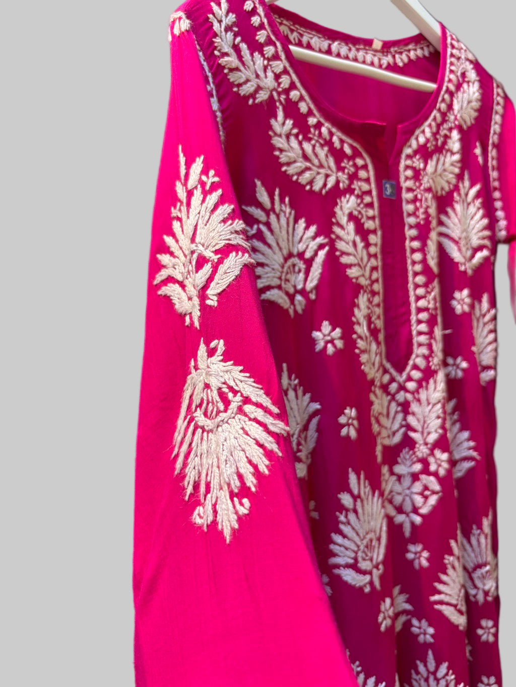 sleeve view of Chikankari long kurti, hot pink with white embroidery in modal fabric