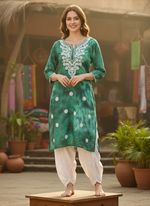 model wearing chikankari tie dye green kurti with dhoti pants