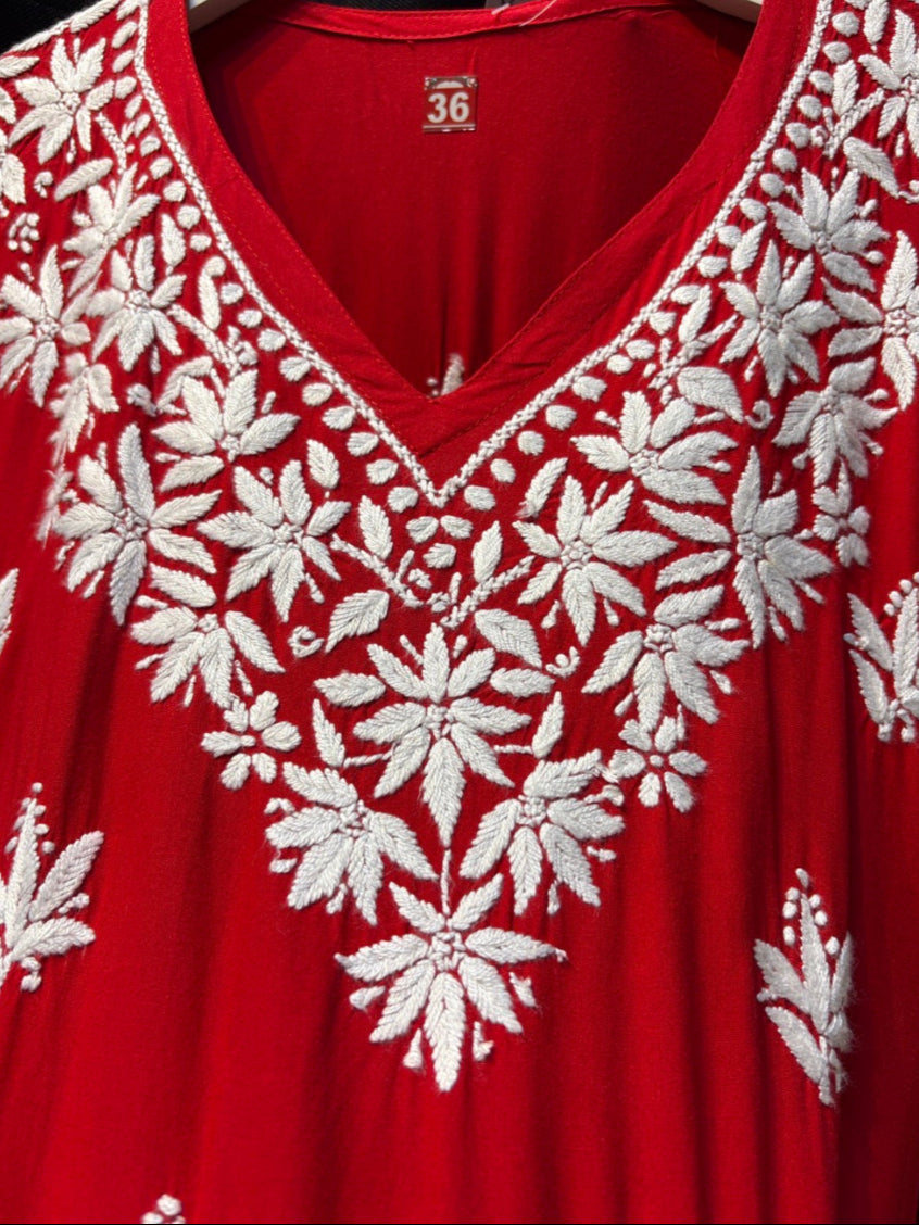 close up of Chikankari short kurti with V neck in red with white embroidery
