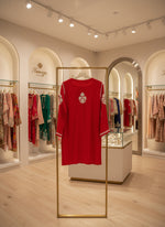 rear view of Chikankari short kurti with V neck in red with white embroidery