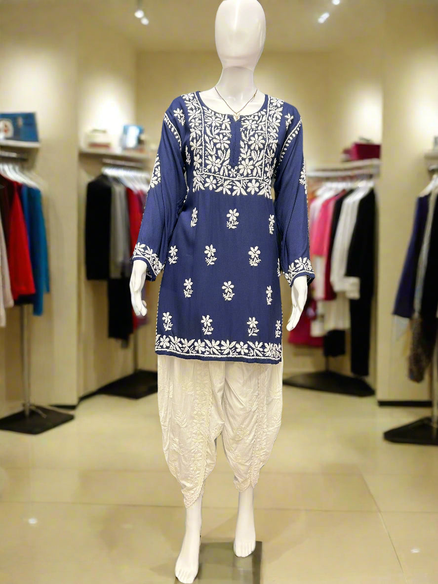 Model wearing Chikankari white floral hand embroidery top paired with tulip pants