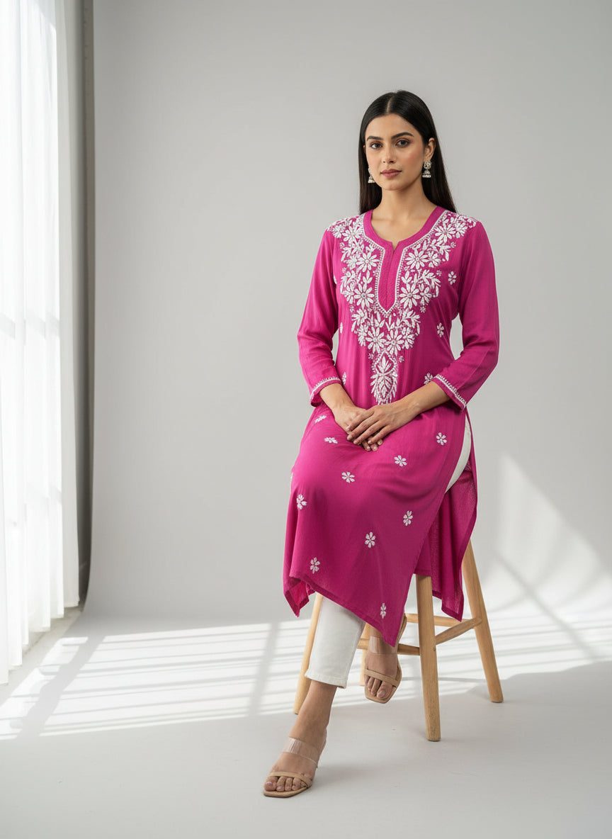 A hot pink colour modal fabric 46 inches long kurti with white hand embroidery in a Ghass Patti pattern and booti work. 