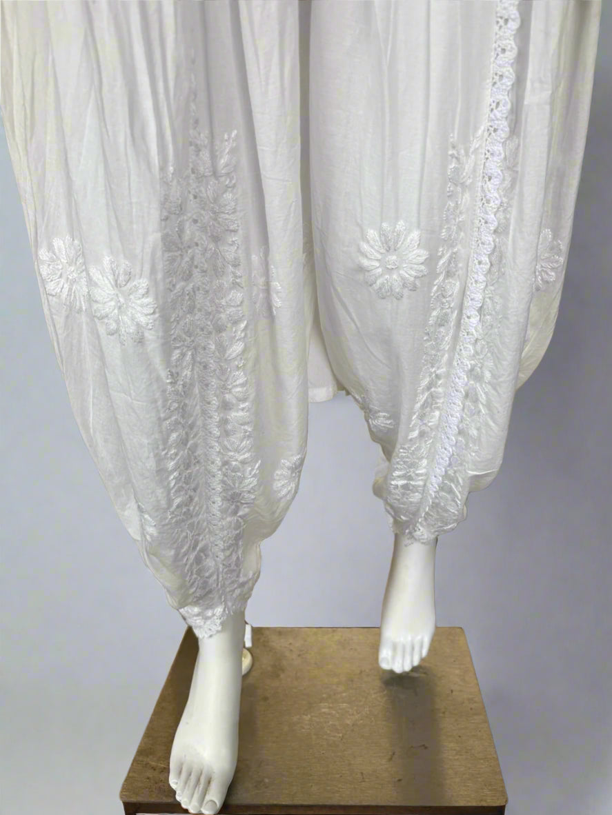 White Chikankari embroidery Dhoti Pants Tulip Trousers on mannequin