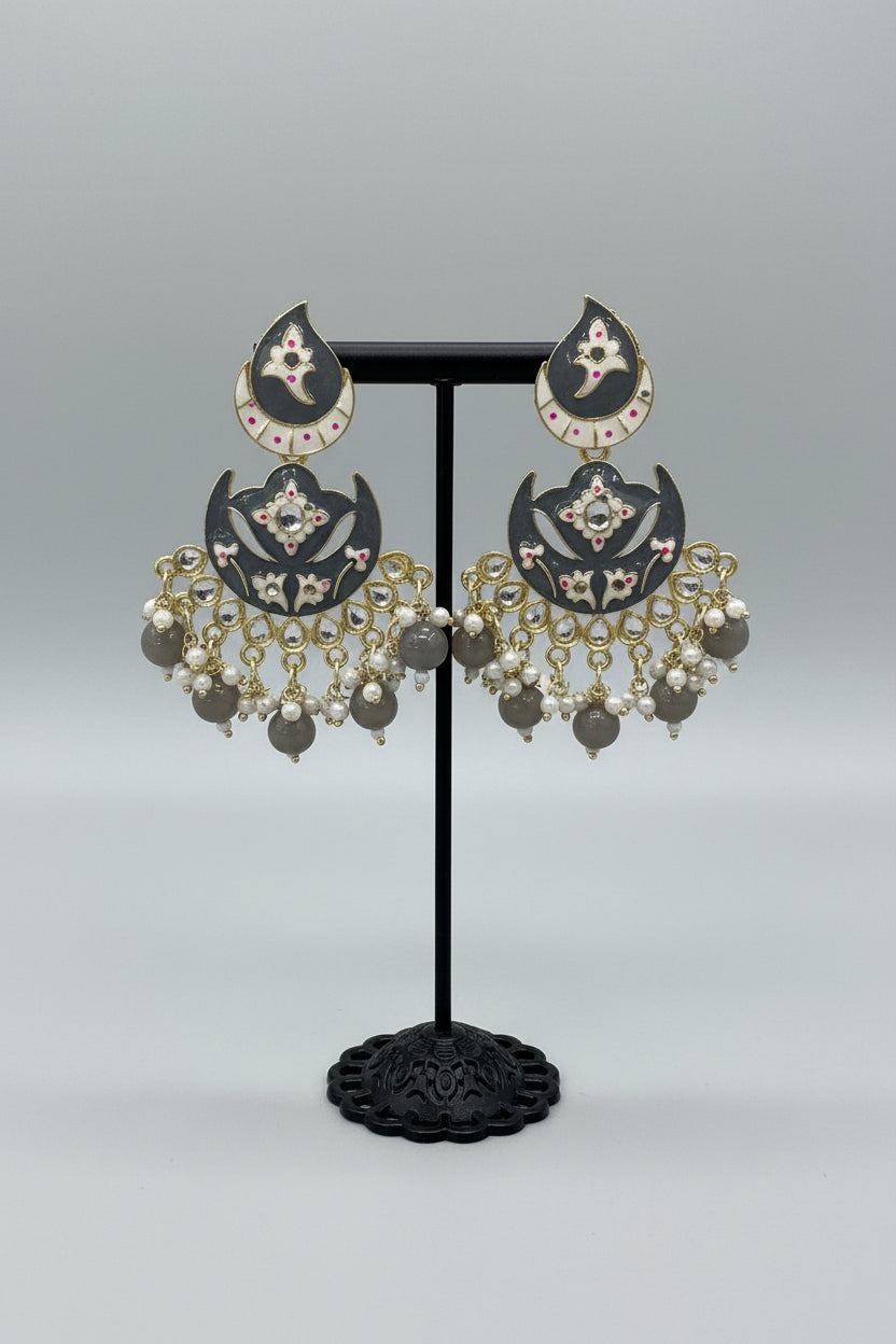 enamel painted grey colour Pair of earrings displayed on a stand. 
