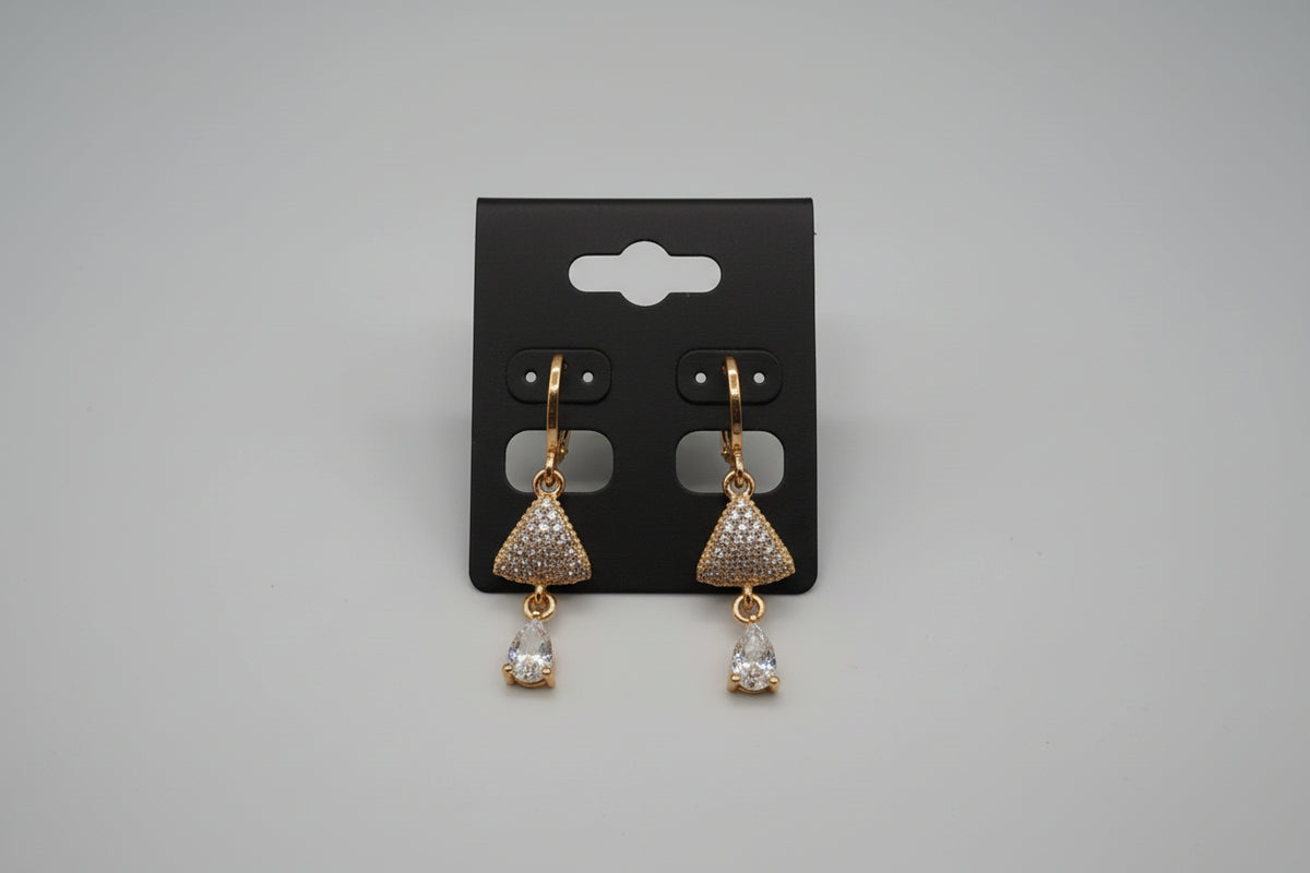 full look from the front view of the Gold triangle-shaped rose gold polished earrings on a stand 