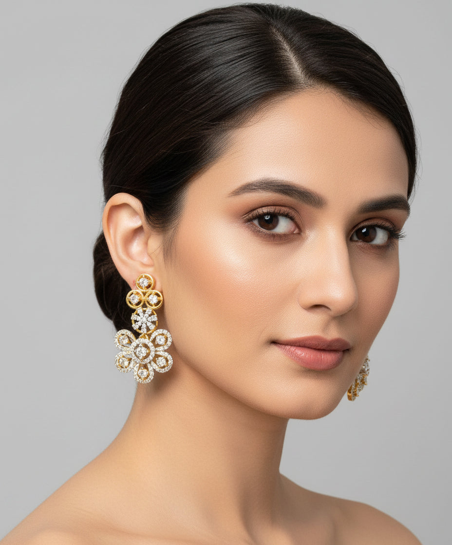 gold plated with white American diamond stones earrings by famaza couture 