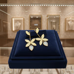 golden polish leaf design earrings with mother of pearl stone in the bottom leaf 