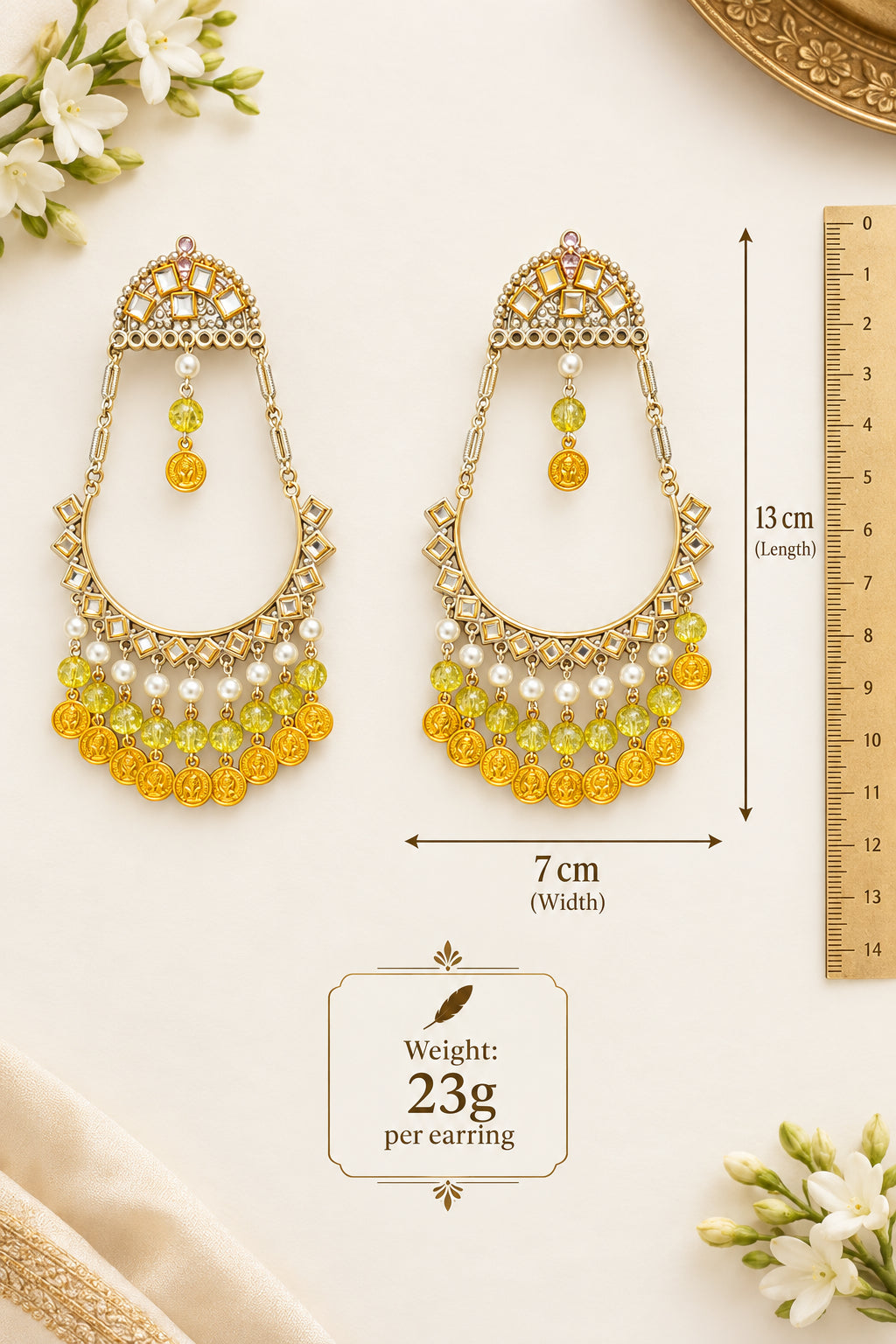 Kahani chandbali earrings with measurements showing a 13 cm drop, 7 cm width and weight of 23 g per earring.