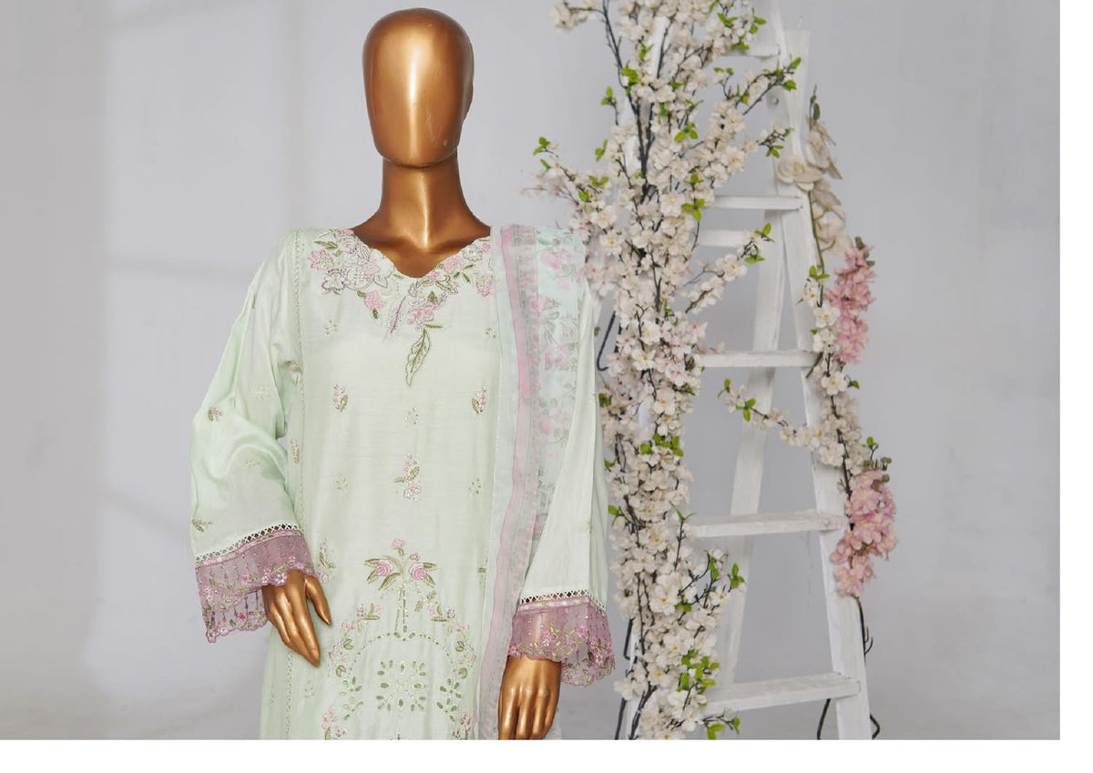 Mint green embroidered kurta on a mannequin with pink scalloped cuffs and a floral dupatta draped over one shoulder.