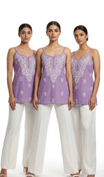 model is showing the purple short tunic in three different styles. 