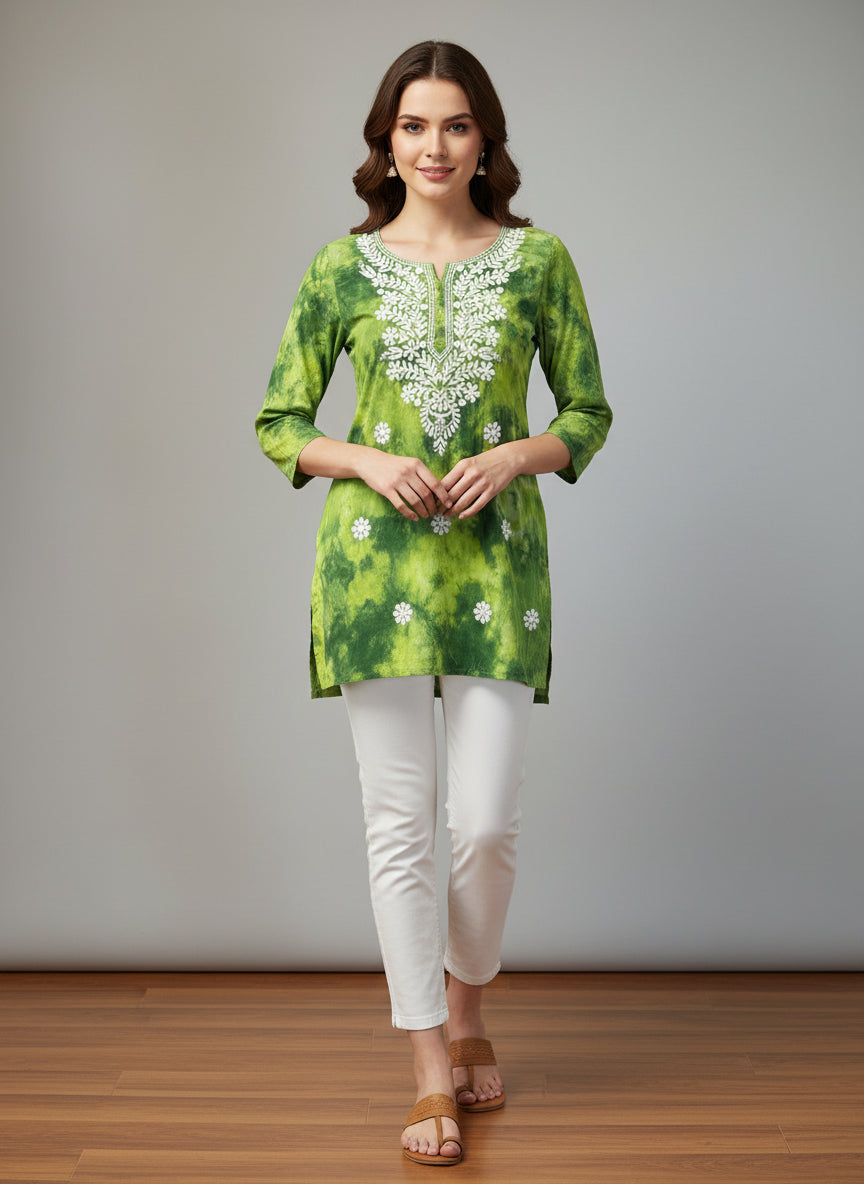 model is wearing this short length green colour kurti in tie & dye colour with white machine embroidery by famaza couture 