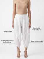 model is wearing white dhoi salwar