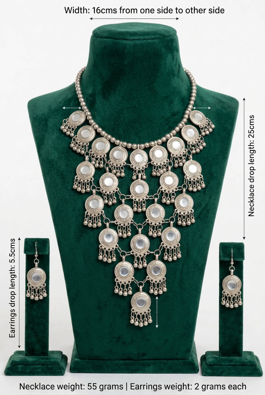 Moonlit Embrace necklace and earrings measurement chart showing listed dimensions and weights on a green velvet display